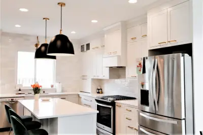 Elegant kitchen featuring recessed cabinets by Avenir Kitchen And Bath