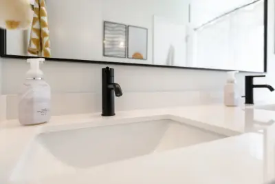 Monochrome Bathroom Renovation by NextGen Remodeling LLC