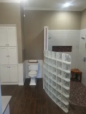Boerne - Glass Block Shower Wall Transformation by Ballroom Baths & Home Design