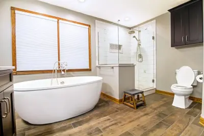 Neutral Toned Master Bathroom by Conrad Kitchen, Bath And Remodeling LLC