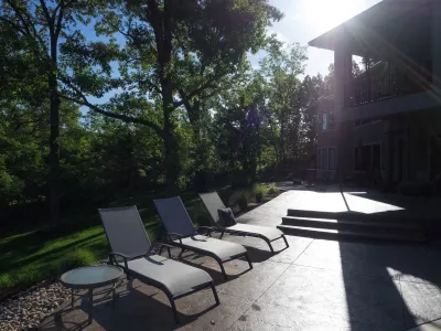 Relaxing Wooded Patio with Pool — Landscape Design project by Meier Landscape Architecture in Shawnee