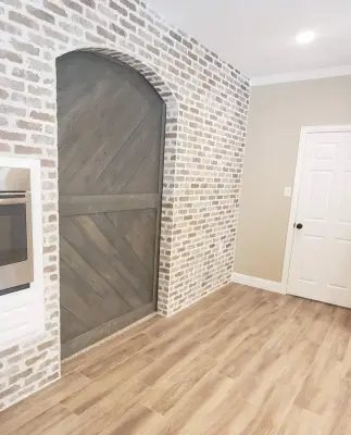 Brick veneer and fireplace renovation by Alcova Construction