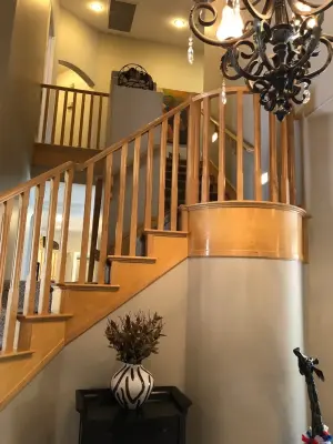 Queensridge Staircase Renovation and Cabinet Restoration by Ranieri Construction LLC