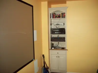 Renovated Basement Featuring New Kitchenette, Integrated Desk, and Entertainment Space by Fiderio & Sons