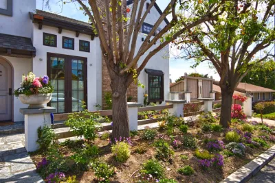 French Courtyard and Frontyard by Mooch Exterior Designs, Inc.