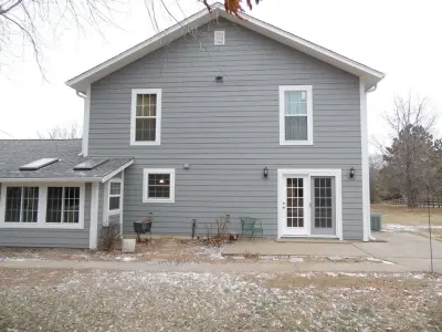 Grey Siding Upgrade from Wood Siding by Trueson Exteriors