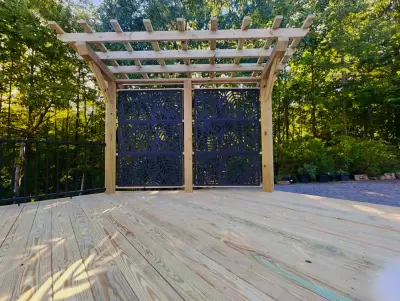 900 square foot deck featuring aluminum railings and a decorative pergola — Home Renovation & Remodeling Services project by Grand Outdoor Living Design