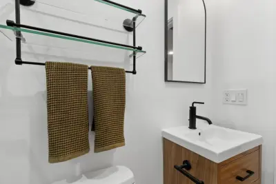 A Minimalist's Vision: Guest Bathroom Renovation in Glassell Park, CA by Vision Home Remodeling, Inc.