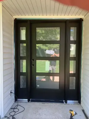 Modern entrance door featuring Pella fiberglass — Window Installation & Replacement project by C & D Home Solutions