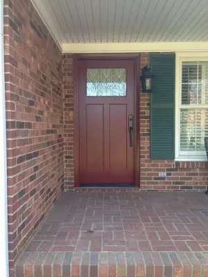 rust-colored entrance door — Window Installation & Replacement project by Pella - Memphis