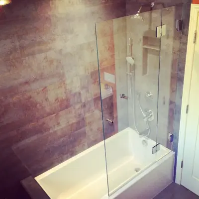 Non-Frame Shower Enclosures — Window Installation & Replacement project by J&M Windows And Glass, Inc.
