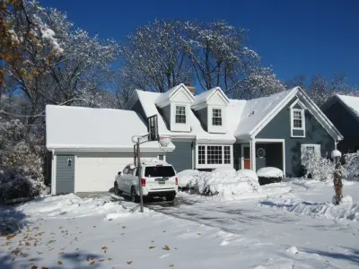 Wheaton project featuring James Hardie siding, Polaris windows, and Air Krete insulation by Schmidt Exteriors, Inc.