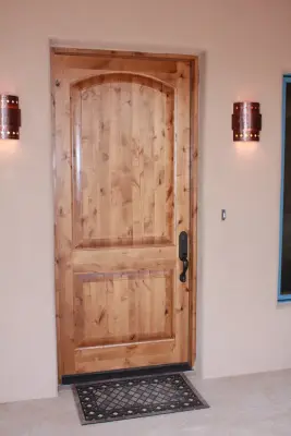Corrales Knotty Alder 2-Panel Entry Door — Window Installation & Replacement project by Moore Window & Door, LLC.
