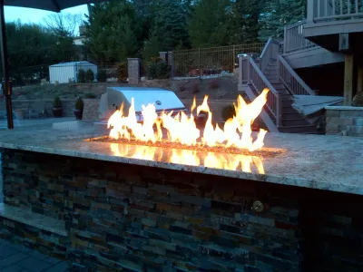 Built-in Fire trough Outdoor Kitchen by Outdoor Living Of NJ