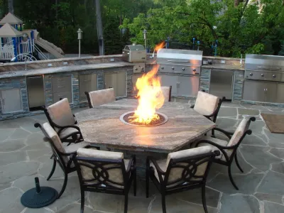 Traditional Outdoor Kitchen & Fire Pit Table — Landscape Design project by Outdoor Living Of NJ in Alpine