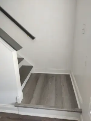 renovated stairs and flooring by JS Renovation And Remodeling