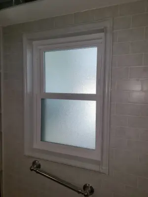 Roman Stone Simtile with Semi-Frameless Bypass Doors and Window Set by AAA Remodeling Of Central Florida