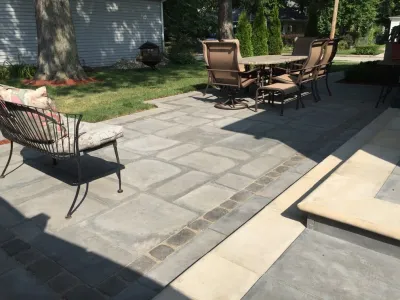 Duck Grey Patio with Cobblestone Accent — Landscape Design project by Prairie Path Group