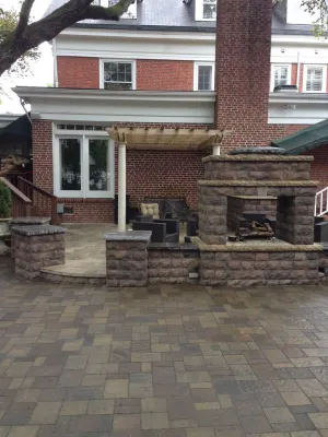 Custom Fireplace and Raised Patio — Landscape Design project by Premiere Landscape Design