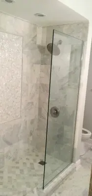 Bespoke marble walk-in shower featuring mosaic inlay — Kitchen Remodeling project by Construction Buddies LLC