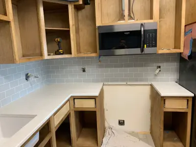 Before and After Backsplash Installation by Ultimate Remodeling