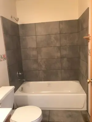Tub surround installation (Before and After) — Kitchen Remodeling project by Ultimate Remodeling