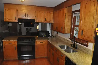 Maple Kitchen Renovation Featuring a Granite Countertop by Kitchen Solvers Of Charleston