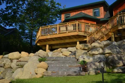 Lake Home with Boulder Walls — Landscape Design project by Redbud Development