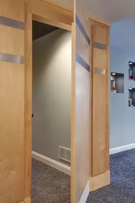 Basement with Theater, Concealed Gaming Room, Kitchen, and Ping Pong Area — Kitchen Remodeling project by Lorrien Homes & Remodeling
