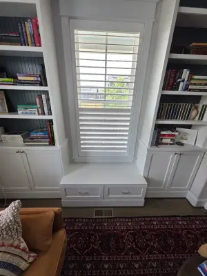 Bespoke Bookcases with Integrated Window Bench and Storage by KBL Remodeling