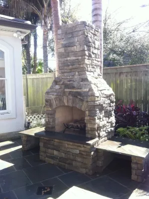 Outdoor Fireplace in New Orleans by Artscape Land Design