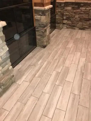 Sunroom Floor Tiling with Porcelain Wood Planks — Kitchen Remodeling project by CC&J Designs. LLC