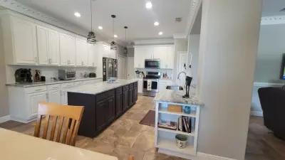 Updated Kitchen Renovation Featuring New White Raised Panel Doors — Kitchen Remodeling project by Kitchen Solvers Of Orlando