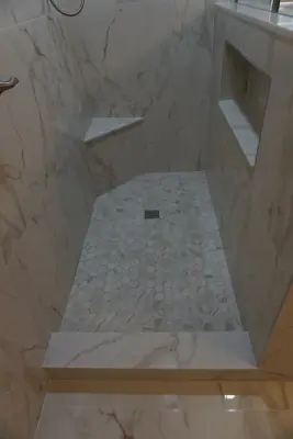 Silver and white marble bathroom renovation — Kitchen Remodeling project by Amos Tile LV