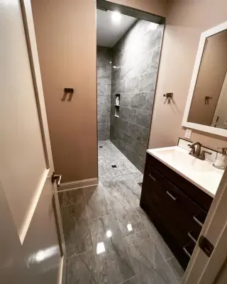 Personalized shower and toilet combination by Homanvestments LLC & Extreme Custom Construction