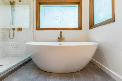 Renovation of the master bathroom by Level Up Construction & Remodeling