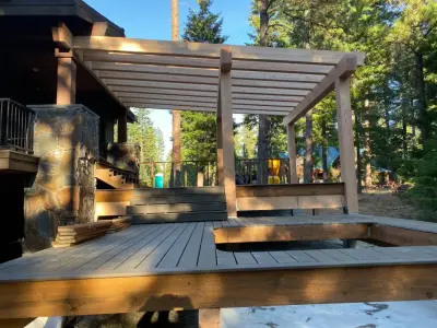 Suncadia deck expansion featuring a kitchenette and hot tub — Home Renovation & Remodeling Services project by Green Phoenix LLC