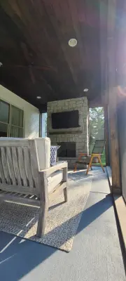 Bespoke fireplace, masonry, and screened porch — Home Renovation & Remodeling Services project by Stratton Exteriors