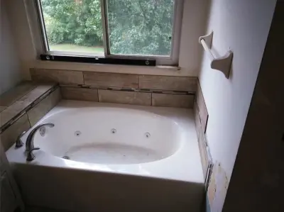 Complete Bathroom Renovation with Herringbone Flooring — Home Renovation & Remodeling Services project by TLC Foundations LLC