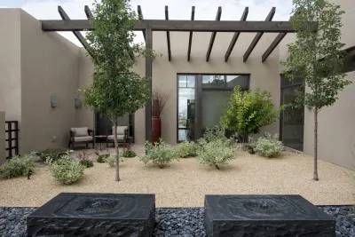 Stone Forest water feauture's in our backdrop — Landscape Design project by Serquis + Associates Landscape Architecture