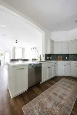 Beautiful Green Kitchen and Fireplace Renovation — Home Renovation & Remodeling Services project by Buck The Builder