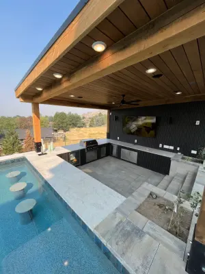 Boise Foothills Personalized Pool and Outdoor Kitchen by Icon Construction & Remodeling
