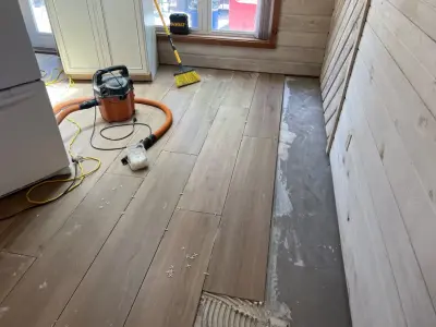 Water Damage Restoration and Porcelain Tile Installation at Lake of Ozarks — Home Renovation & Remodeling Services project by IMG Construction Services