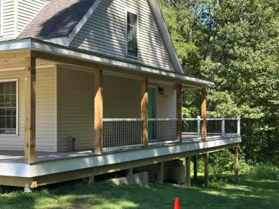 Enclosed wraparound porch — Home Renovation & Remodeling Services project by Bolton Home Remodelers