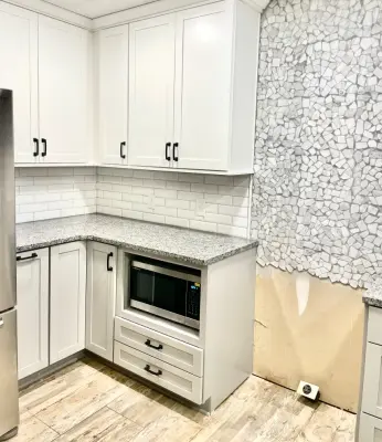Light Subway Tile Backsplash — Home Renovation & Remodeling Services project by TG Construction & Design, Inc.