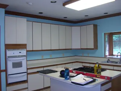 Kraftmaid kitchen with Netuno Bordeaux countertops by A.M.Carter Construction Inc