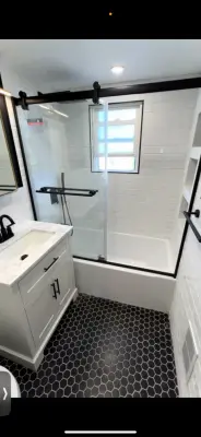 Contemporary Monochrome Bathroom Renovation in Glendale Queens — Home Renovation & Remodeling Services project by Novu Designs