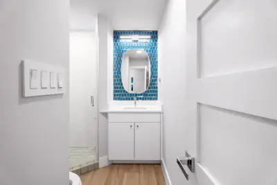 Contemporary Blue and White Kitchen and Bathroom Renovation by Jonestar Construction