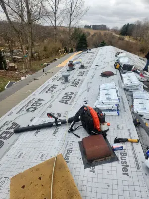 Contemporary Roof Replacement Caused By Wind Damage In Sand Lake Michigan by Haight N' Sons LLC