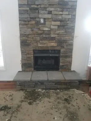 Dry-stacked stone hearth — Home Renovation & Remodeling Services project by S & T Remodeling